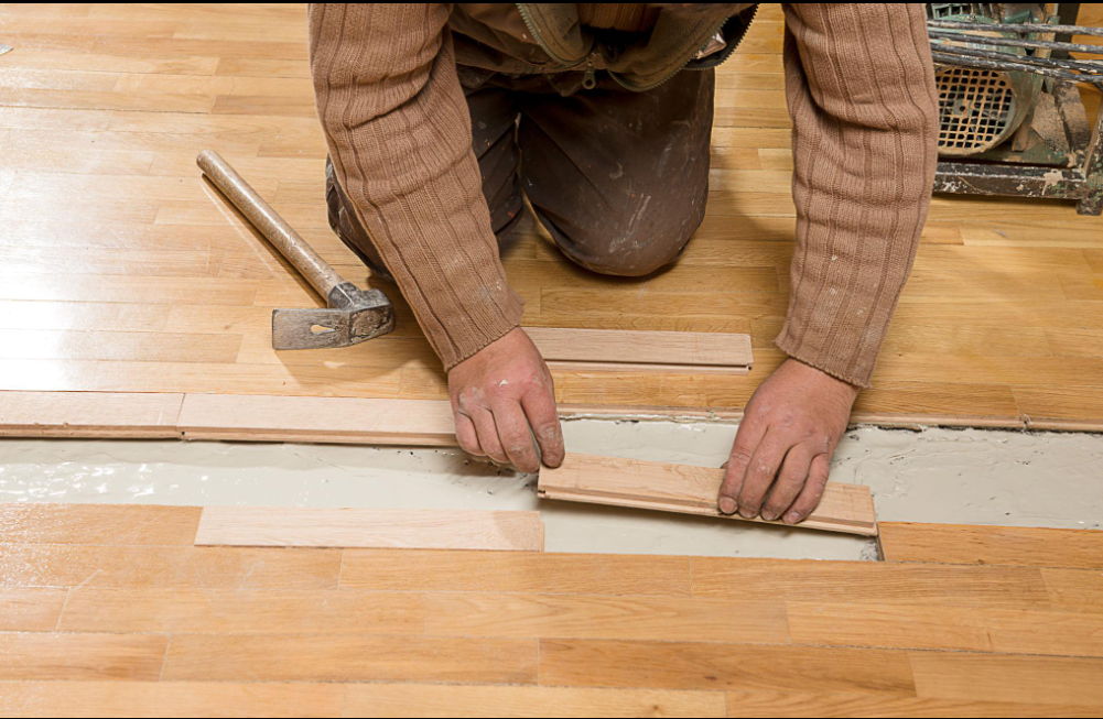 Wood floor repair service fixing damaged hardwood flooring